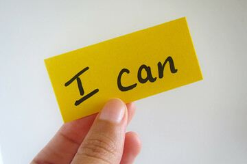 Hand holding a positive message: 