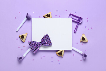 Blank card with hamantaschen cookies, party whistles and decor for Purim holiday on lilac background