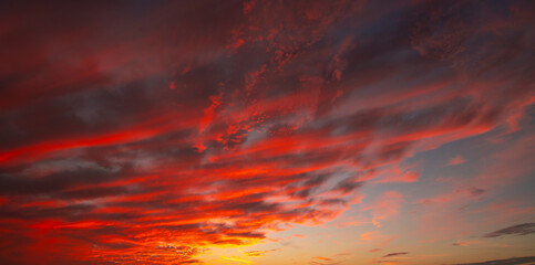 Sunrise background. Dramatic sunset background. Sky with clouds in Sunrise sky light background. Sunrise with clouds in various shapes background. Calm Sunrise.