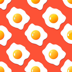 Fried eggs. Seamless pattern. Isolated on an orange background