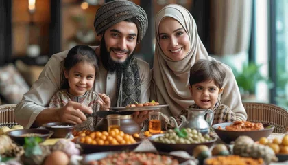 Fotobehang image of a family breaking their fast together © azzammusthofa