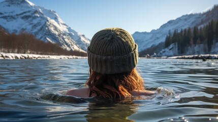  A Revolutionary Cold Plunge Ice Bath. Cold Water Therapy. Woman in winter hat taking ice bath outdoor  cold water of a frozen and snowy lake. 