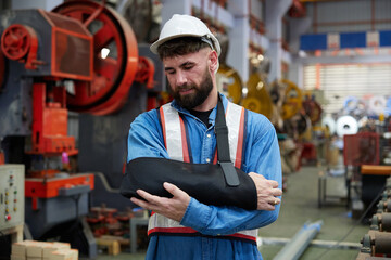 worker or engineer wearing bandages splint, pain in elbow and ache in arm from hard work in the...