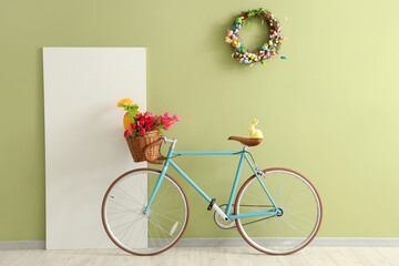 Interior of room with Easter wreath, bicycle and blank poster - obrazy, fototapety, plakaty