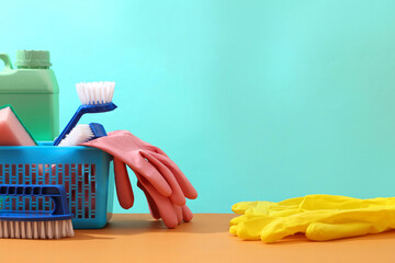 Scene for advertising cleansing products, cleaning service with copy space. A blue basket filled...