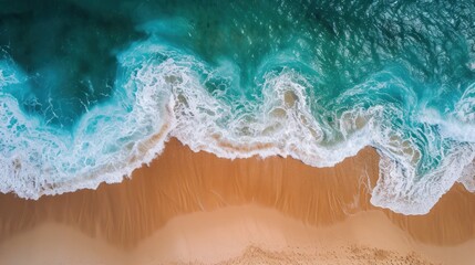Obraz premium an aerial view of a beach with waves crashing on the sand and a sandy beach with a blue ocean in the background.