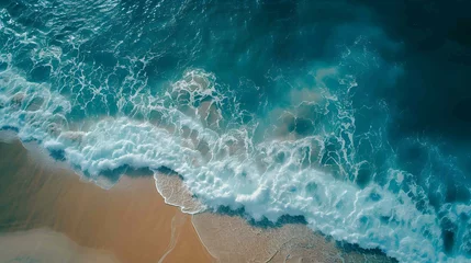 Fototapeten Amazing aerial view of emerald green sea, small white sand beach with perfect nature and white foamy waves crashing on the shore on a sunny day. © Some