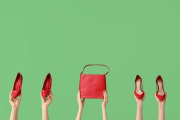 Women with red heels and bag on green background
