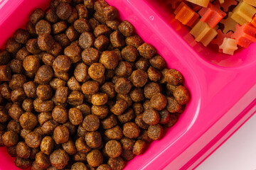 Dry pet food granules for background top view