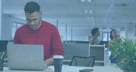 Image of financial data processing over biracial businessman using laptop in office