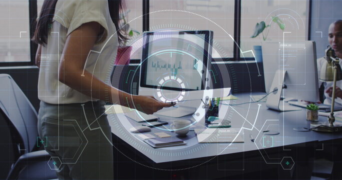 Image of data processing over biracial businesswoman working in office