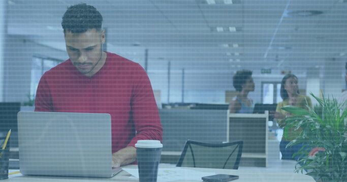 Image of financial data processing over biracial businessman using laptop in office