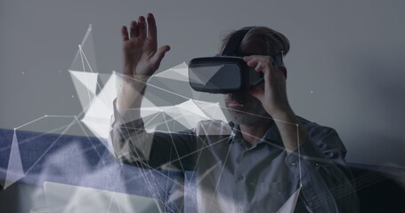 Image of connections and data processing over caucasian businessman using vr headset in office