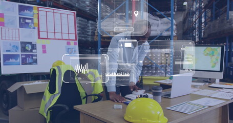 Image of data processing on screen over biracial man working in warehouse