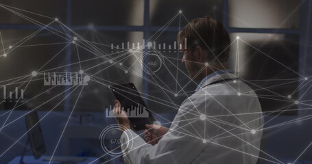 Image of data and network of connections over caucasian male doctor using tablet