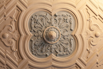 Plaster rosette with a geometric pattern on the ceiling of an ancient manor