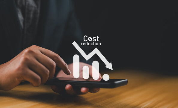 Cost reduction Concept. Businessman with his hand lowers the arrow of the graph. Cost text with a down arrow. budget,Cost Management