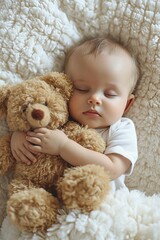 Carefree sleep little baby with a soft toy on the bed.