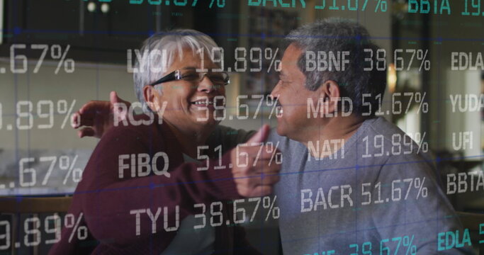 Image of financial data processing over happy senior couple checking bills at home