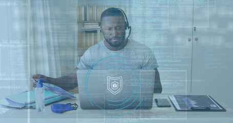 African American cybersecurity professional at work in an office