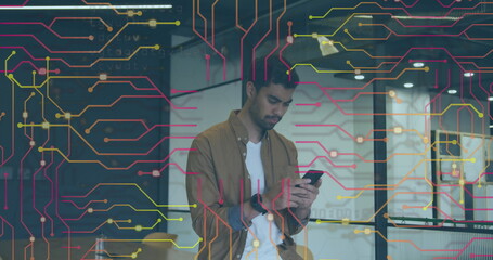 Image of data processing over biracial businessman using smartphone