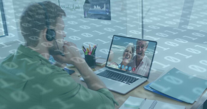 Image of binary coding numbers changing over man using laptop on image call in background