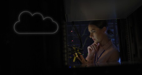 Image of cloud over caucasian woman working in server room
