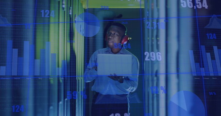 Image of graphs and data over asian man in server room
