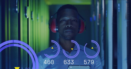 Image of graphs and data over african american man in server room