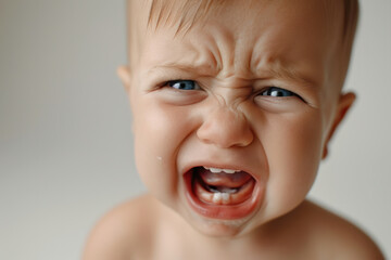 Expressive toddler crying, capturing childhood emotions. Child behavior.