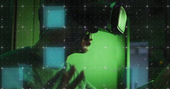 Image of glitch over asian wearing vr headset in server room