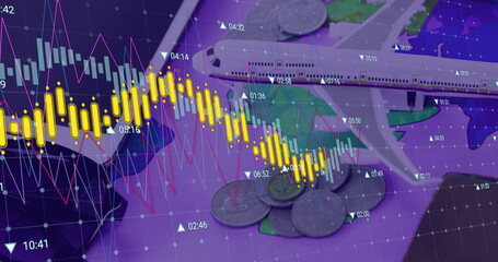 Image of financial data processing over plane model and coins