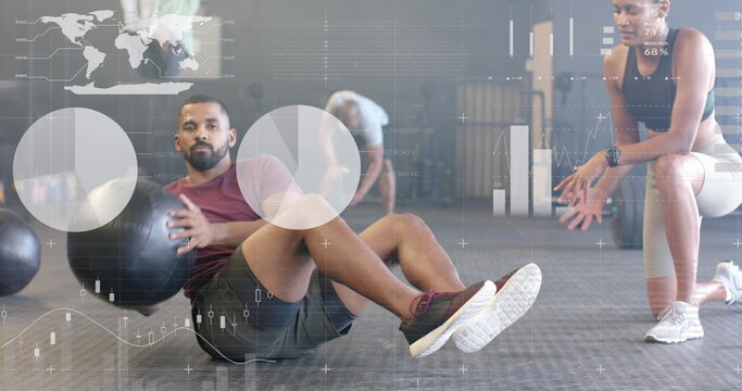 Image of data on interface over biracial female trainer and man cross training with ball at gym