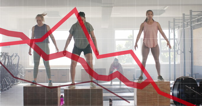 Image of graph processing data over diverse women jumping on boxes cross training at gym