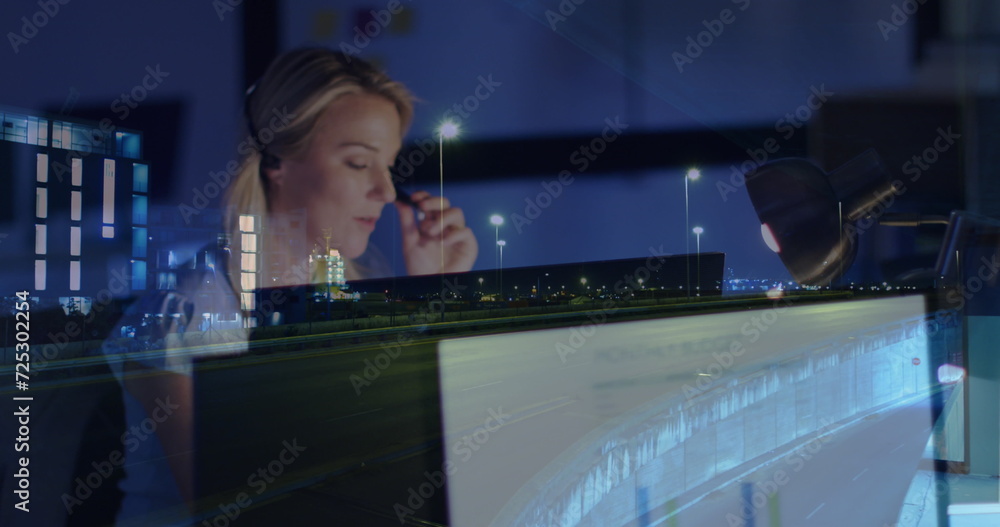 Poster image of caucasian businesswoman using computer over data processing and cityscape