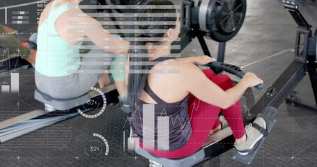 Image of interface processing data over caucasian women training on rowing machines at gym