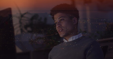 Image of biracial businessman using phone over data processing and cityscape