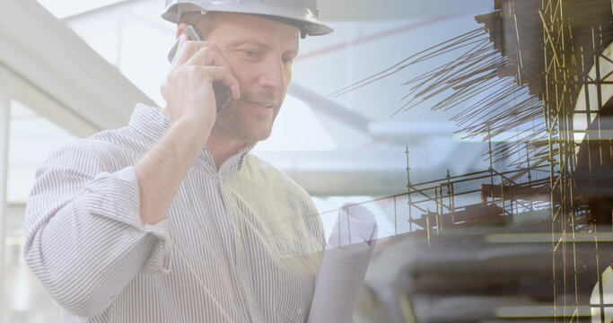 Image of caucasian male architect with phone and plans over cityscape
