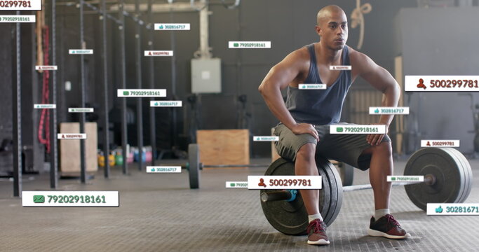 Image of social media notifications over biracial man sitting on barbell at gym
