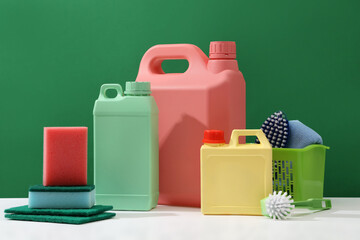 House cleaning concept, cleaning service with colorful set of cleaning supplies decorated on dark...