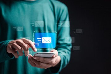 Marketing or newsletter concept, Person use smartphone with virtual Email icons for Send bulk...