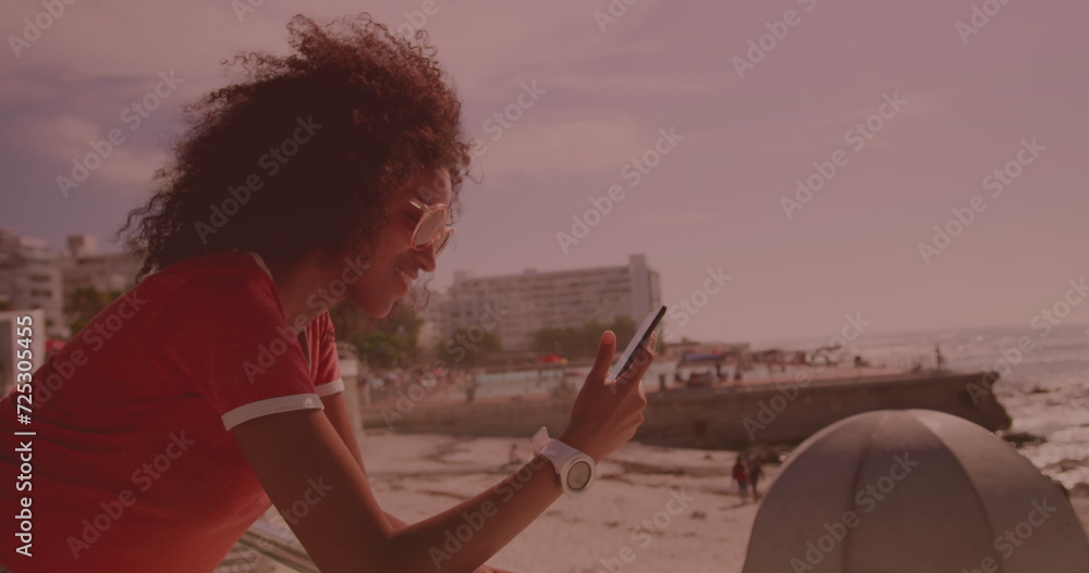 Poster image of data processing on screen over woman using smartphone