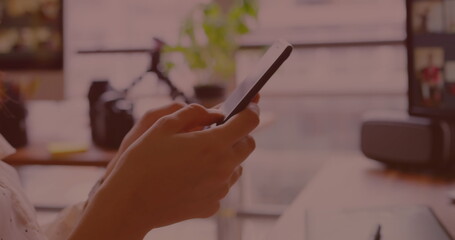 Image of data processing on screen over woman using smartphone