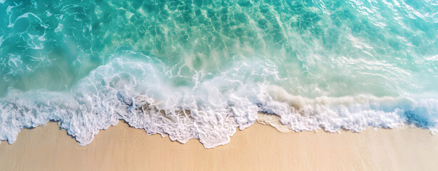 Fototapeta na wymiar Beautiful tropical beach along the coastline with waves, Aerial drone view of sandy beach.