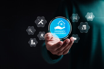 Property management concept. Businessman holding virtual screen of property management icon for...