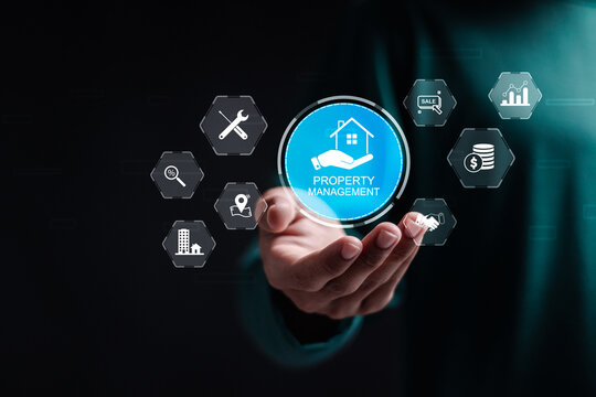 Property management concept. Businessman holding virtual screen of property management icon for operation control maintenance and oversight of real estate and physical property.