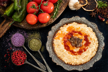 Harees or keşkek at the dining table . A meal with wheat and meat. 