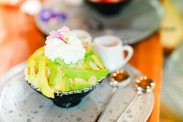 Bingsu or shaved ice with avocado is a delicious and refreshing dessert.