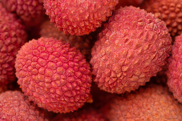 Lychee exotic fruits background. Close up, top view