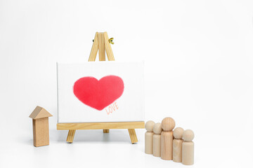 Mannequin with easel on white background; love or family concept